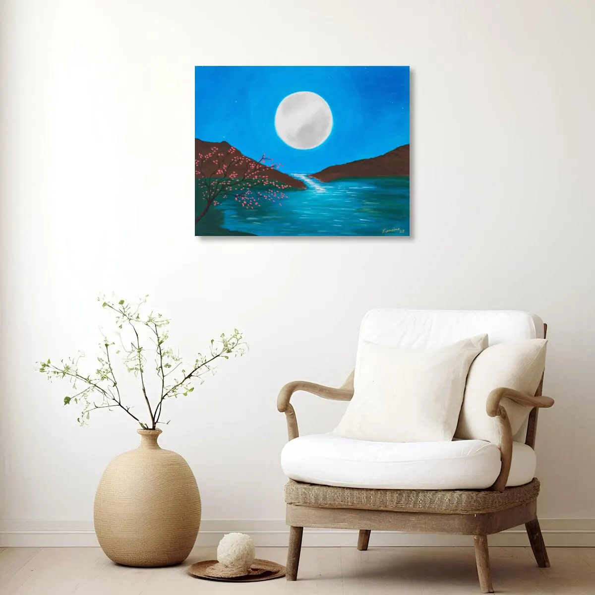 Mega Moon in a Scandinavian Reading Corner Mega Moon original acrylic painting by Lorraine Artsy displayed in a Scandinavian style reading corner with light wood, neutral colours and a comfortable armchair